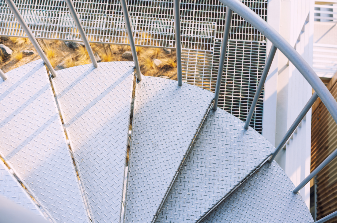 Elegant commercial spiral stairs with durable metal finish.